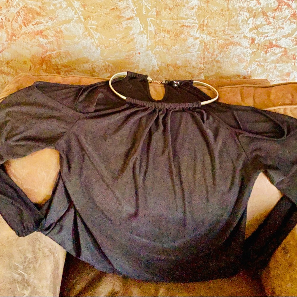 Black peek-a-boo top. Gold adornments!